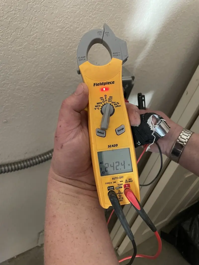 Voltage testing with clamp meter during Outlet Installation in Willits